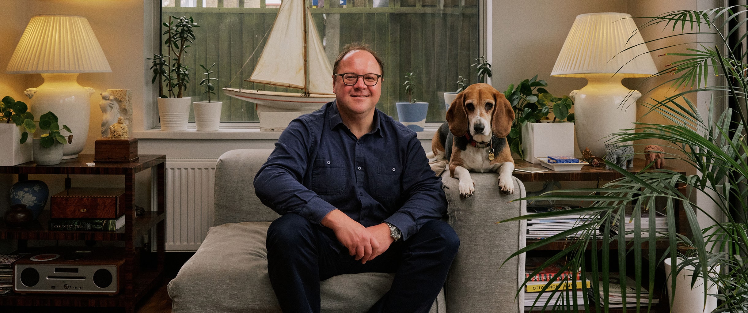 Founder with a dog in a living room